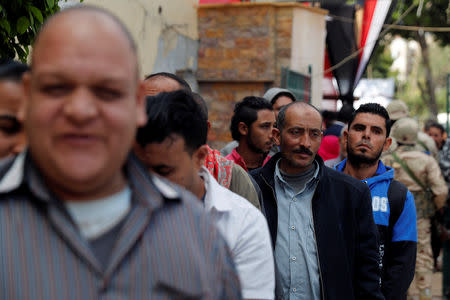 People wait in line to cast their votes during the second day of the referendum on draft constitutional amendments, at a polling station in Cairo, Egypt April 21, 2019. REUTERS/Amr Abdallah Dalsh