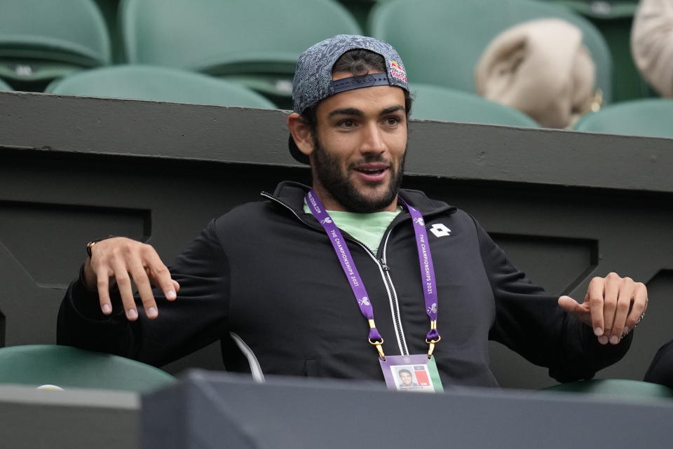 Matteo Berrettini waits for the start of the women's singles quarterfinals match between Australia's Ashleigh Barty and Australia's Ajla Tomljanovic on day eight of the Wimbledon Tennis Championships in London, Tuesday, July 6, 2021. (AP Photo/Kirsty Wigglesworth)