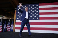 Virginia democratic gubernatorial candidate Terry McAuliffe waves as he arrives to speak during a campaign event at Lubber Run Park, Friday, July 23, 2021, in Arlington, Va. (AP Photo/Andrew Harnik)