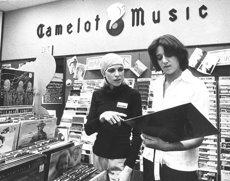 Nancy McCarly and Darlene Whisenaut check out records at Camelot Music at the DeSoto Square Mall.