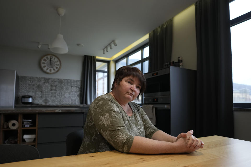 Elena Koposova sits in her house in the village of Rogaca, Serbia, Tuesday, Feb. 13, 2024. When Elena Koposova signed an open letter against Russia's full-scale invasion of Ukraine, she didn’t expect a backlash in her newly adopted home state of Serbia. (AP Photo/Darko Vojinovic)