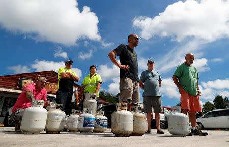 Customers line up to buy propane at Socastee Hardware store, ahead of the arrival of Hurricane Florence in Myrtle Beach, South Carolina, U.S. September 10, 2018. REUTERS/Randall Hill