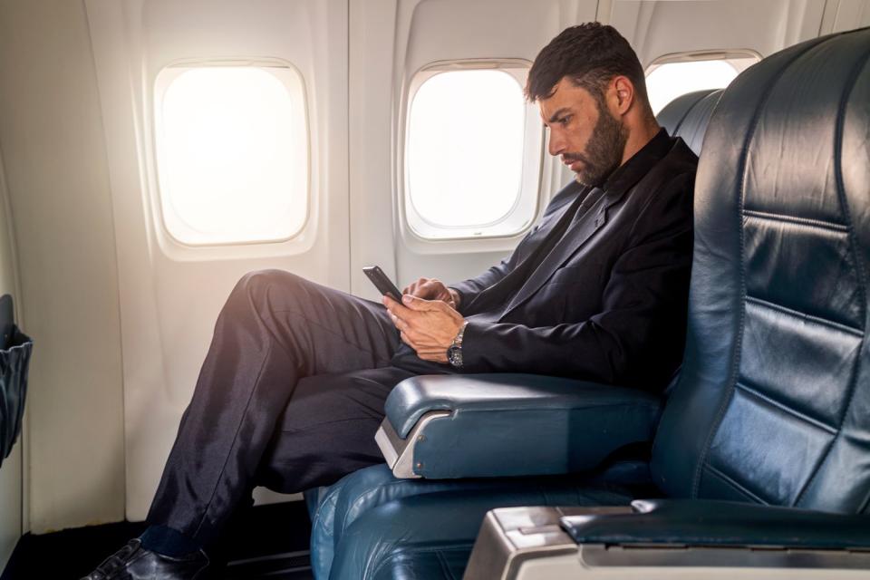 <p>Getty</p> Image of a passenger with an empty seat next to them.