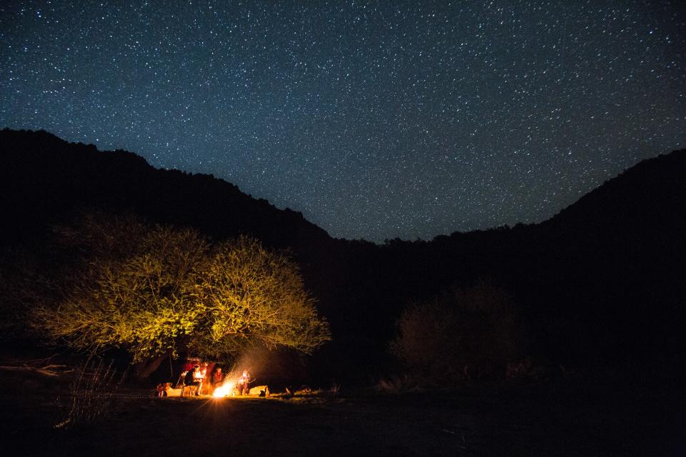 Dinner and stargazing down by the river at Pata Lodge, where electricity usage is restricted after nightfall.