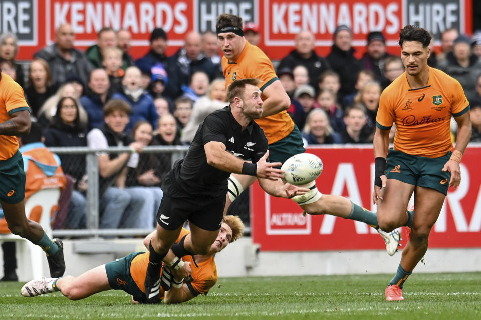 New Zealand's Braydon Ennor passes the ball during the Bledisloe Cup rugby test match between the All Blacks and Australia in Dunedin, New Zealand, Saturday, Aug. 5, 2023. (John Davidson/Photosport via AP)