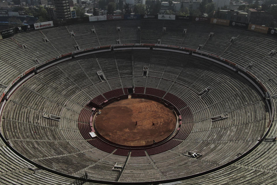 The Plaza de Toros Mexico bullring is empty as a bullfighter trains in Mexico City, Tuesday, Dec. 12, 2023. The spectacle took a critical blow in 2022 when a judge banned bullfighting in Mexico City, but now that the country's Supreme Court of Justice has overturned the ban, the controversial sport is set to return to the capital, home to what is billed as the world's largest bullfighting ring. (AP Photo/Fernando Llano)