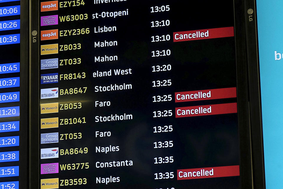 Screens display cancelled Monarch flights after the airline ceased trading (REUTERS/Mary Turner)