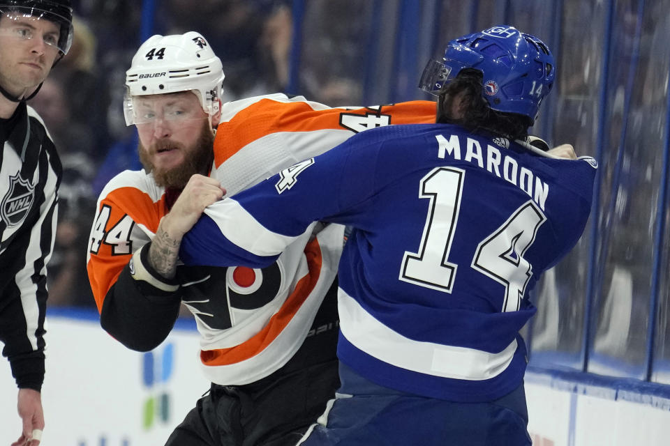 Tampa Bay Lightning left wing Pat Maroon (14) and Philadelphia Flyers left wing Nicolas Deslauriers (44) fight during the first period of an NHL hockey game Tuesday, Oct. 18, 2022, in Tampa, Fla. (AP Photo/Chris O'Meara)