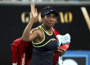 United States' Venus Williams waves as she leaves the court following her first round loss to compatriot Cori "Coco" Gauff at the Australian Open tennis championship in Melbourne, Australia, Monday, Jan. 20, 2020. (AP Photo/Dita Alangkara)
