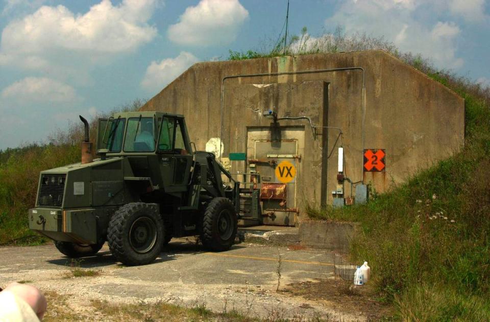 A forklift removes a concrete block securing a bunker containing chemical weapons during a media day tour of the chemical weapons at the Bluegrass Army Depot in Richmond, Ky. September 6, 2001. Photo by Pablo Alcala | Staff