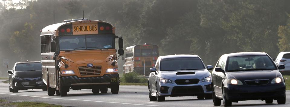 Flagler County school bus navigates heavy State Road 100 traffic near Flagler Palm Coast High School, Wednesday, Aug. 10, 2022, as Flagler County students return on the first day of school. Renewal of the half-cent sales tax could fund the purchase of new school buses over the next 10 years.