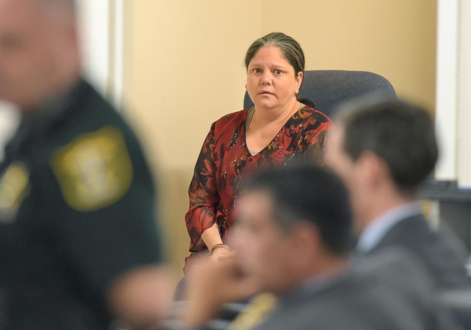 Christine Fenton Gilbert, of Fort Pierce, sits in a holding room after being sentenced by Circuit Judge William Roby in the Martin County Courthouse.