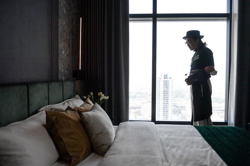 Daniel Bian, a Chinese potential property buyer from Shanghai, visits a luxury condominium in Bangkok