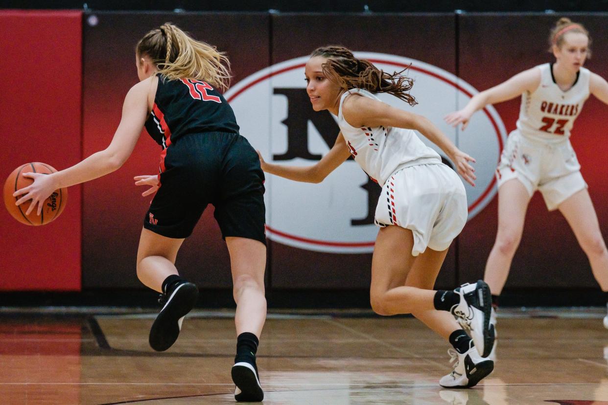 New Philadelphia's Lasha Robinson guards Tusky Valley's Leah Bourquin as she drives down court, Wednesday, Feb. 8.