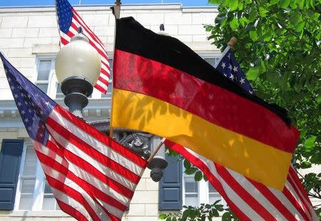 American and German flags hang together at Blair House across from the White House in Washington June 6, 2011. REUTERS/Kevin Lamarque/Files