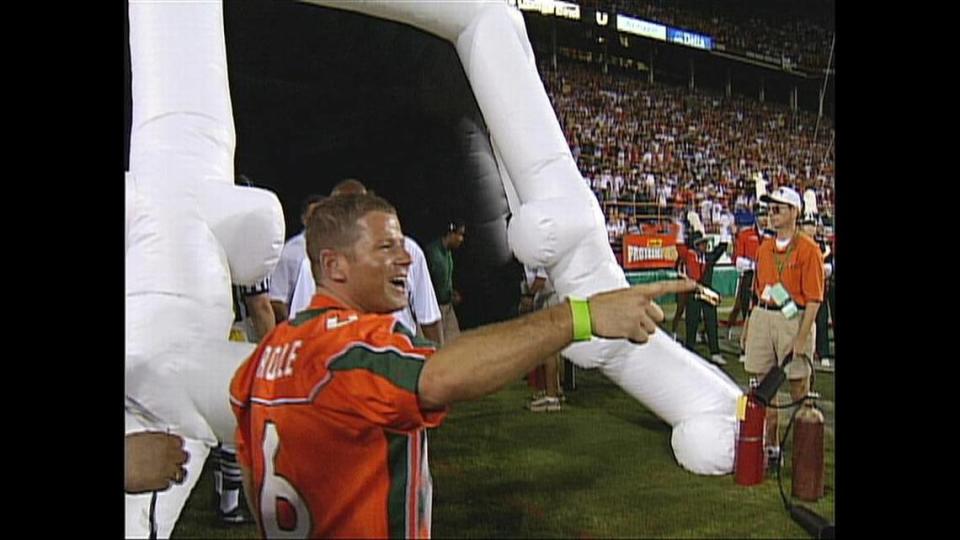 Nevin Shapiro is shown on the field near the inflated UM helmet covering the tunnel entrance. The framegrab is from a video made at the University of Miami vs. University of Florida game in September 2003.