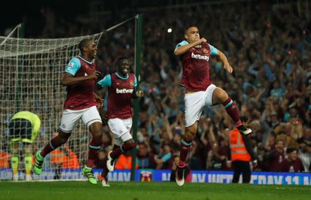 Britain Soccer Football - West Ham United v Manchester United - Barclays Premier League - Upton Park - 10/5/16 West Ham's Winston Reid celebrates scoring their third goal with teammates Action Images via Reuters / John Sibley