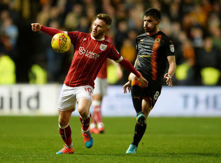 Soccer Football - Championship - Bristol City vs Wolverhampton Wanderers - Ashton Gate Stadium, Bristol, Britain - December 30, 2017 Bristol City's Matty Taylor in action with Wolves' Ruben Neves Action Images/Alan Walter