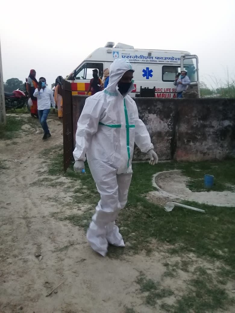 In the last hour of polling at Chausa Narayanpur booth number 222 of Buxar assembly constituency, polling personnel, wearing PPE kits, cast their votes. 