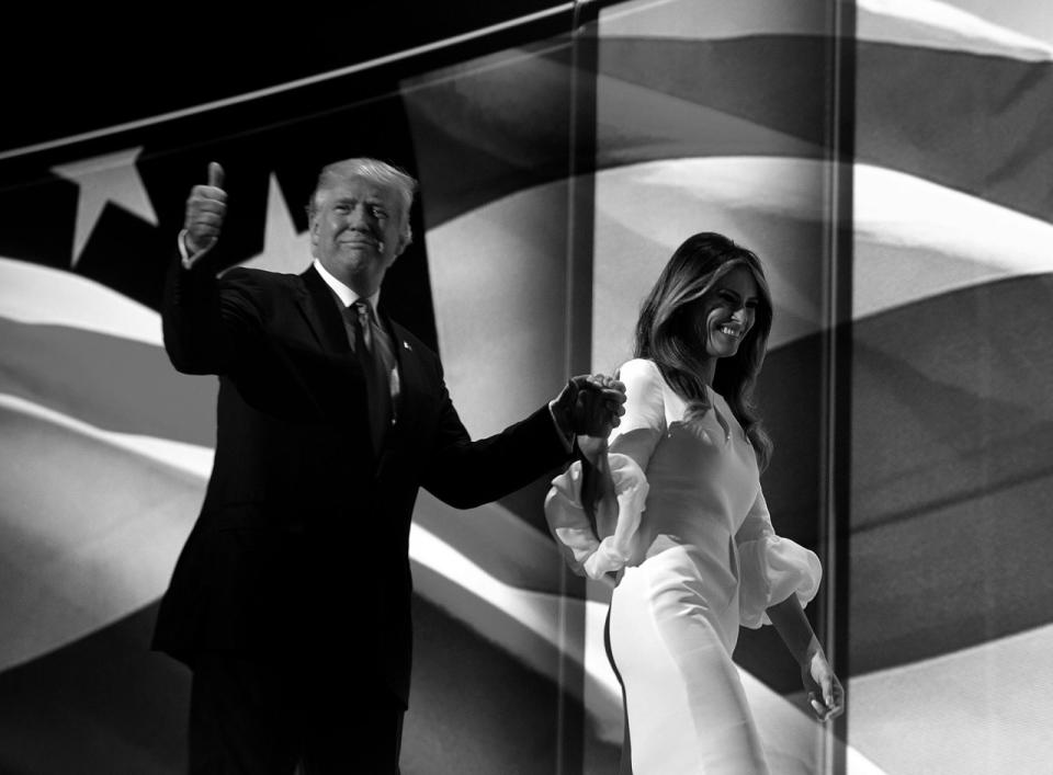 <p>Donald Trump walks off with his wife, Melania, after she spoke at the Republican National Convention on Monday. (Photo: Khue Bui for Yahoo News)</p>