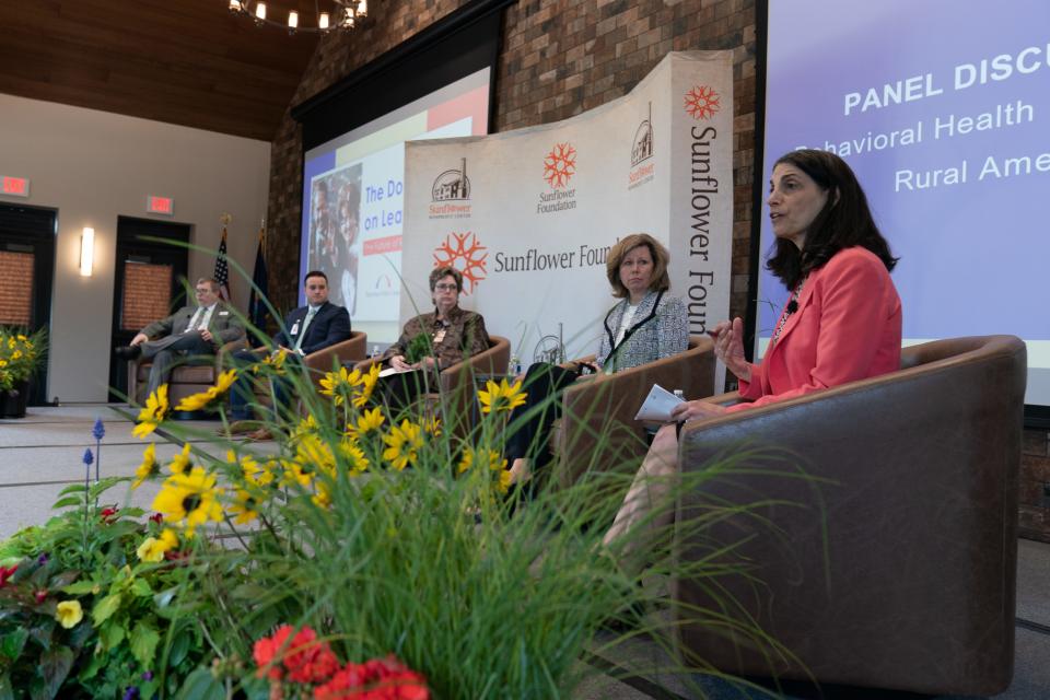 Marilyn Serafini, far right, executive director of health program for the Bipartisan Policy Center, kicks off Wednesday's panel discussion on behavioral health integration in rural America at the Sunflower Foundation.