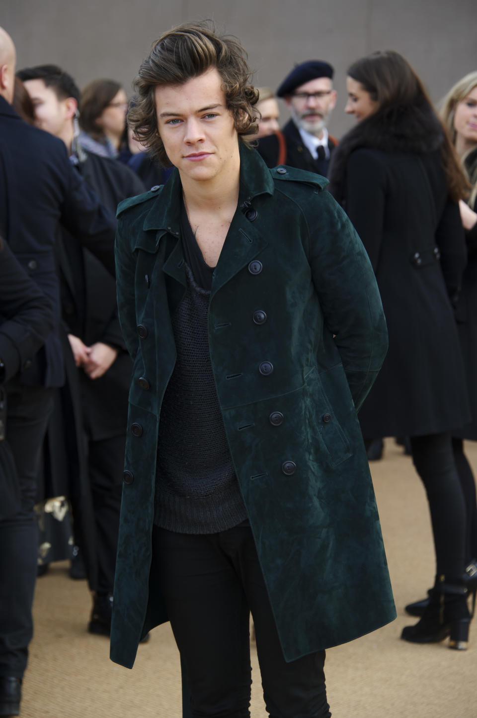 British singer Harry Styles arrives for the Burberry Prorsum Womenswear collection during London Fashion Week Autumn / Winter 2014 in central London, Monday, Feb. 17, 2014. (Photo by Jonathan Short/Invision/AP)