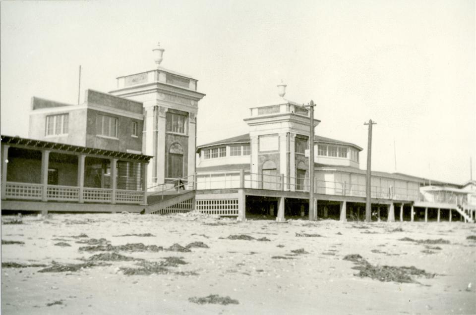 On the evening of July 4, 1913, a fight broke out between two sailors and two young Black men on the deck between the two towers that marked the entrance to Easton's Beach, Newport, seen here circa 1913.