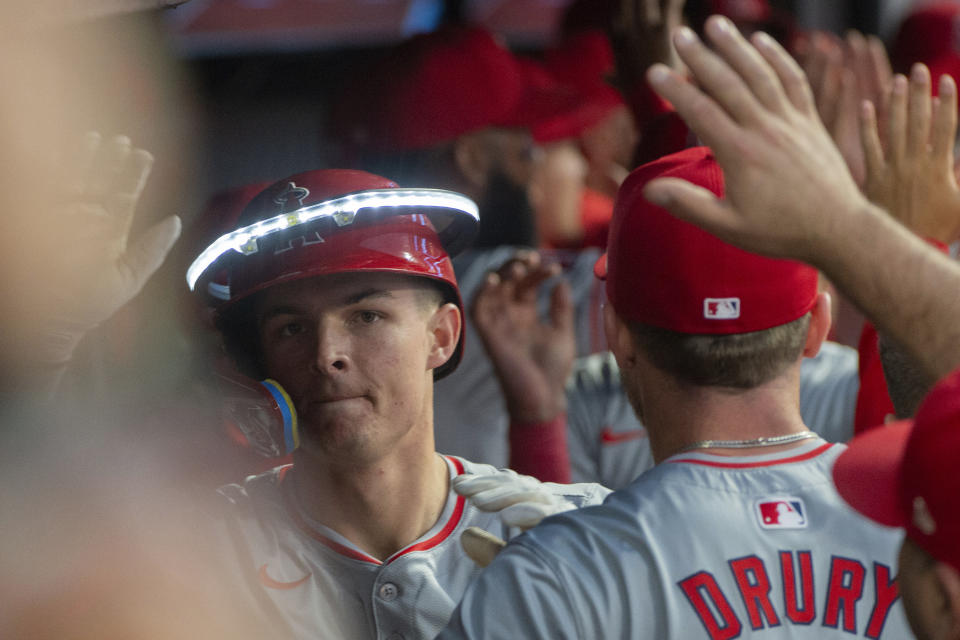 Los Angeles Angels' Micky Moniak is greeted by his teammates after hitting a three-run home run off Cleveland Guardians starting pitcher Tanner Bibee during the fourth inning of a baseball game in Cleveland Friday, May 3, 2024. (AP Photo/Phil Long)