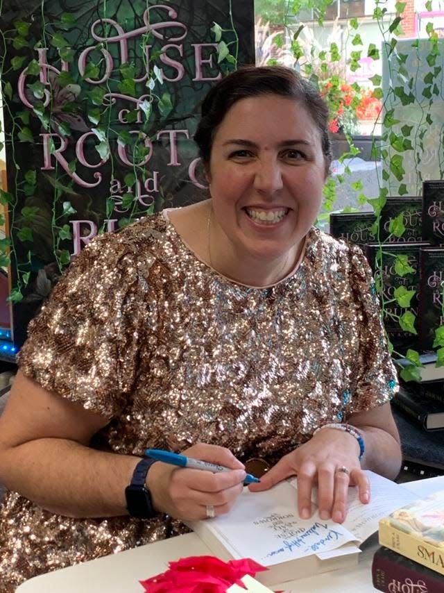 Spring Lake native Erin Craig signs copies of her latest book during an event at the Book Cellar in Grand Haven.