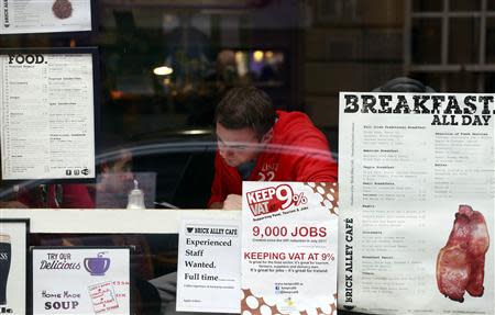 A campaign poster calling for the retention of the 9% VAT rate for the hospitality sector is displayed in a Dublin city centre cafe ahead of Ireland's budget later this month, October 4, 2013. REUTERS/Cathal McNaughton