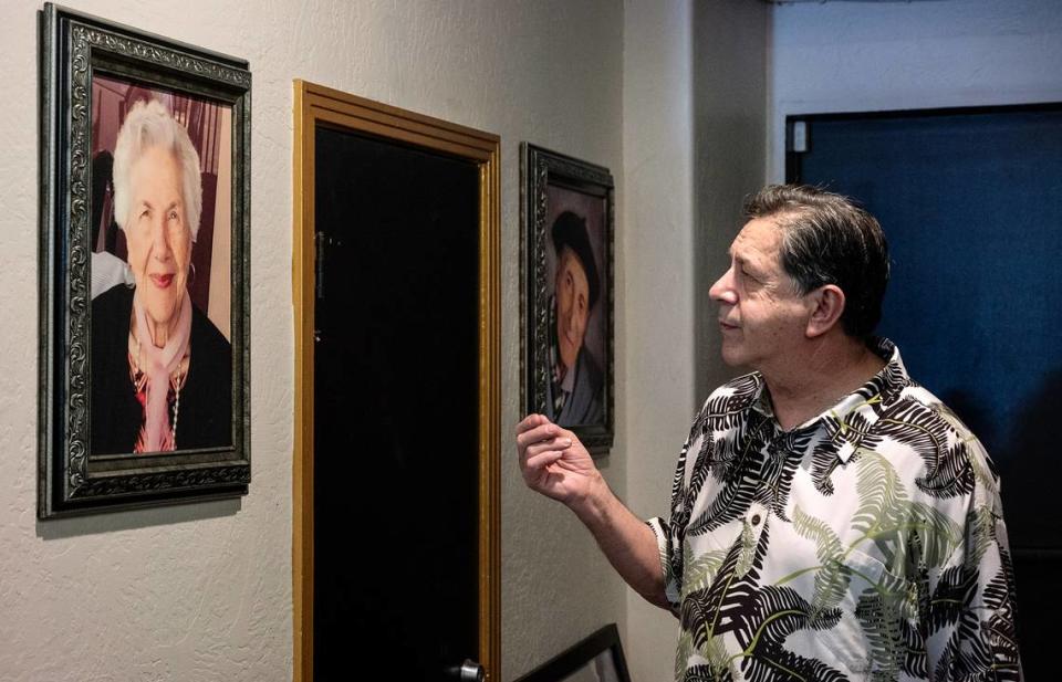 Vinny Altadonna looks at a portrait of his mother Emilia Altadonna at Chefs of New York Italian restaurant in Modesto, Calif., on Friday, July 9, 2021.