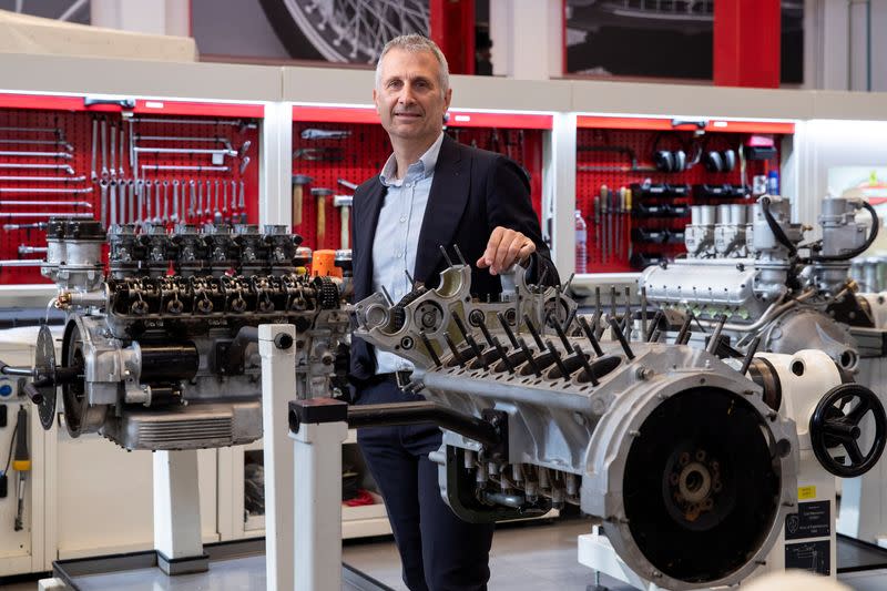 Modena poses for a picture in a garage at the Ferrari factory in Maranello