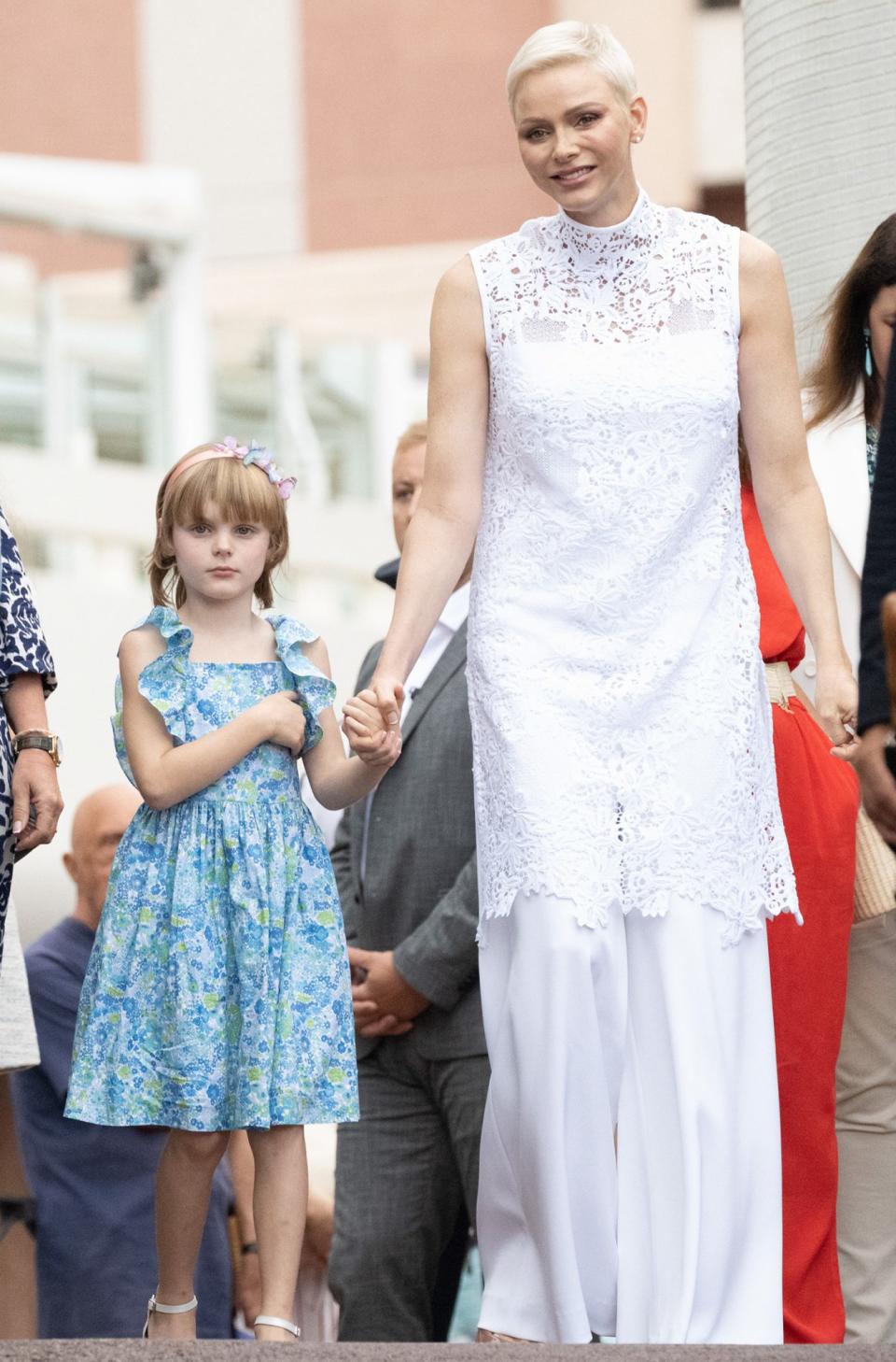 <p>Monaco's annual end of summer picnic saw Charlene in a high collared white lace tunic and pants from South African designer Terence Bray. Meanwhile, Princess Gabriella wore a blue Jacadi dress — and Prince Jacques sported a shirt in the same pattern.</p>