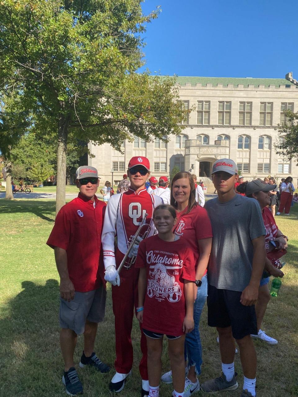Cale Richardson from Dale, a trumpet player in the Pride of Oklahoma, is pictured on campus with his family.