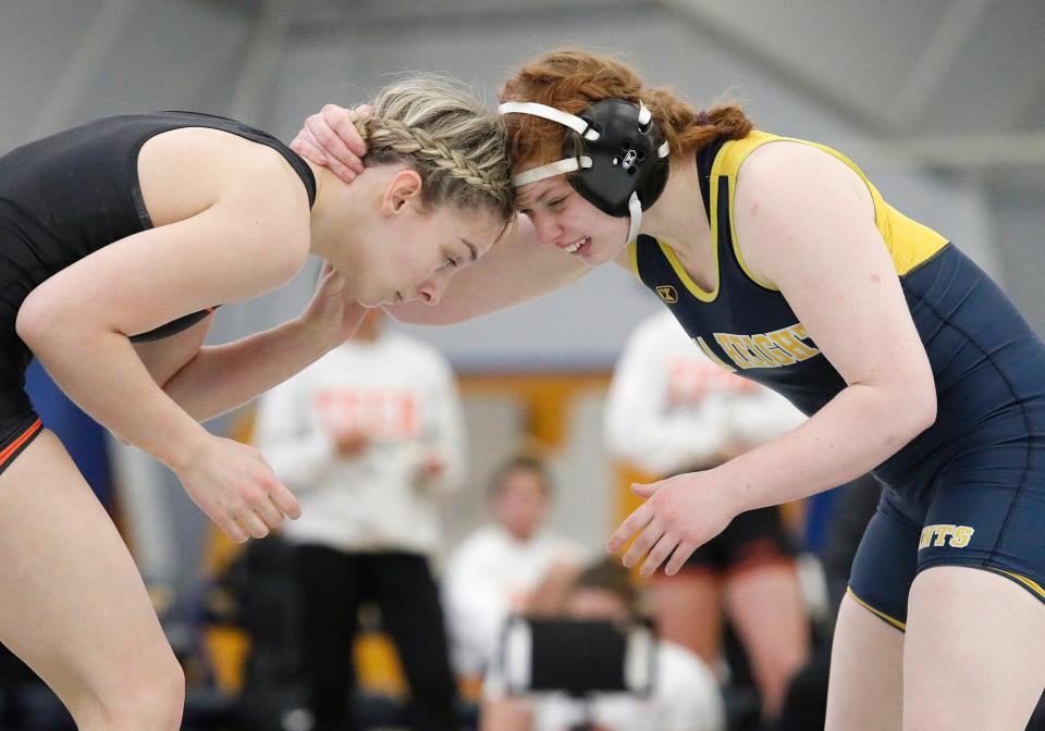 Phoenix Walters of Siena Heights (right) goes head-to-head with Indiana Tech's Alyssa Pirro Thursday night.