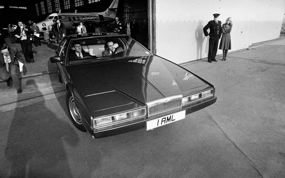 Prince Philip drives a prototype Aston Martin Lagonda. 17th February 1978. - Getty 