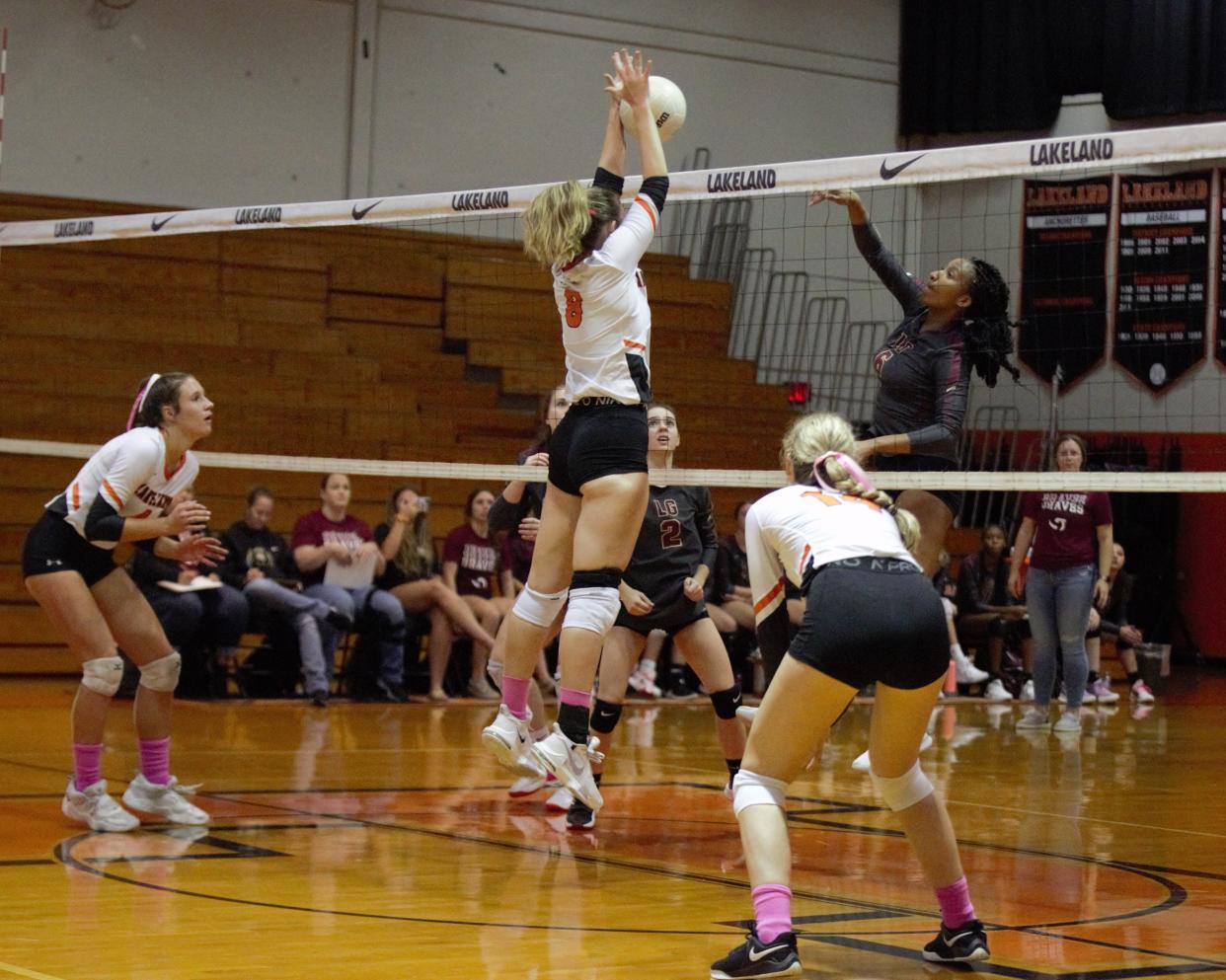 Lakeland middle blocker Julia Black blocks a ball in a district contest semifinal. Lakeland won 3-0 over Lake Gibson.