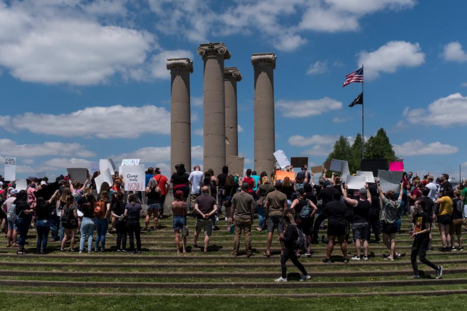 People gather for an anti-violence rally at the Four Freedoms Monument in Downtown Evansville, Ind., Saturday, May 30, 2020.