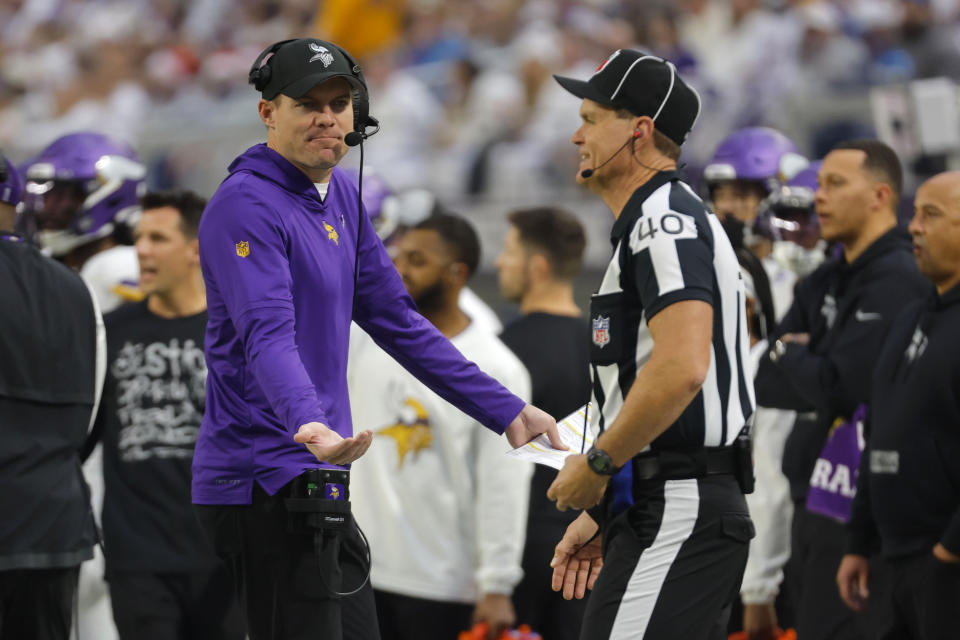 Minnesota Vikings head coach Kevin O'Connell, left, reacts to a call during the first half of an NFL football game against the Detroit Lions, Sunday, Dec. 24, 2023, in Minneapolis. (AP Photo/Bruce Kluckhohn)