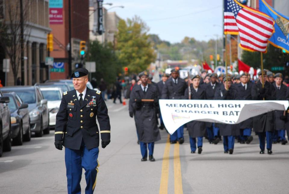 Retired Col. Greg Barrack, shown with his ROTC students, died recently. Barrack oversaw a Junior ROTC program in Tulsa.