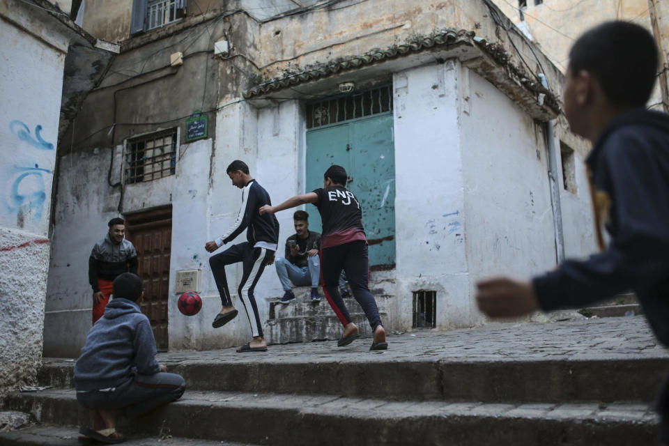Children play football in Kasbah of Algiers, a UNESCO world heritage site, Algeria, Thursday, April 11, 2019. (AP Photo/Mosa'ab Elshamy)