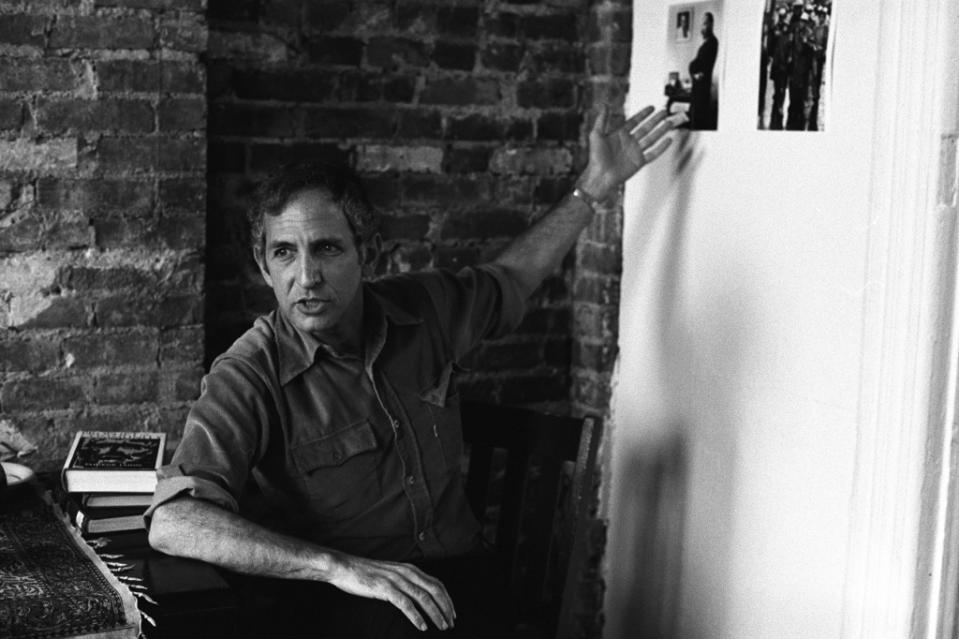 American military analyst and political activist Daniel Ellsberg gestures towards a picture on a wall, October 10, 1976. Ellsberg was the source of the leak of the controversial 'Pentagon Papers,' a goverment document about the decision-making process during the Vietnam War. (Photo by Susan Wood/Getty Images)