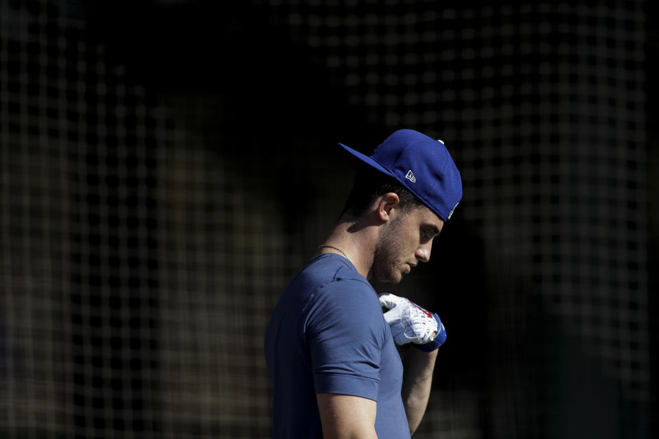 Los Angeles Dodgers center fielder Cody Bellinger leaves the batting cages during spring training baseball Friday, Feb. 14, 2020, in Phoenix. (AP Photo/Gregory Bull)