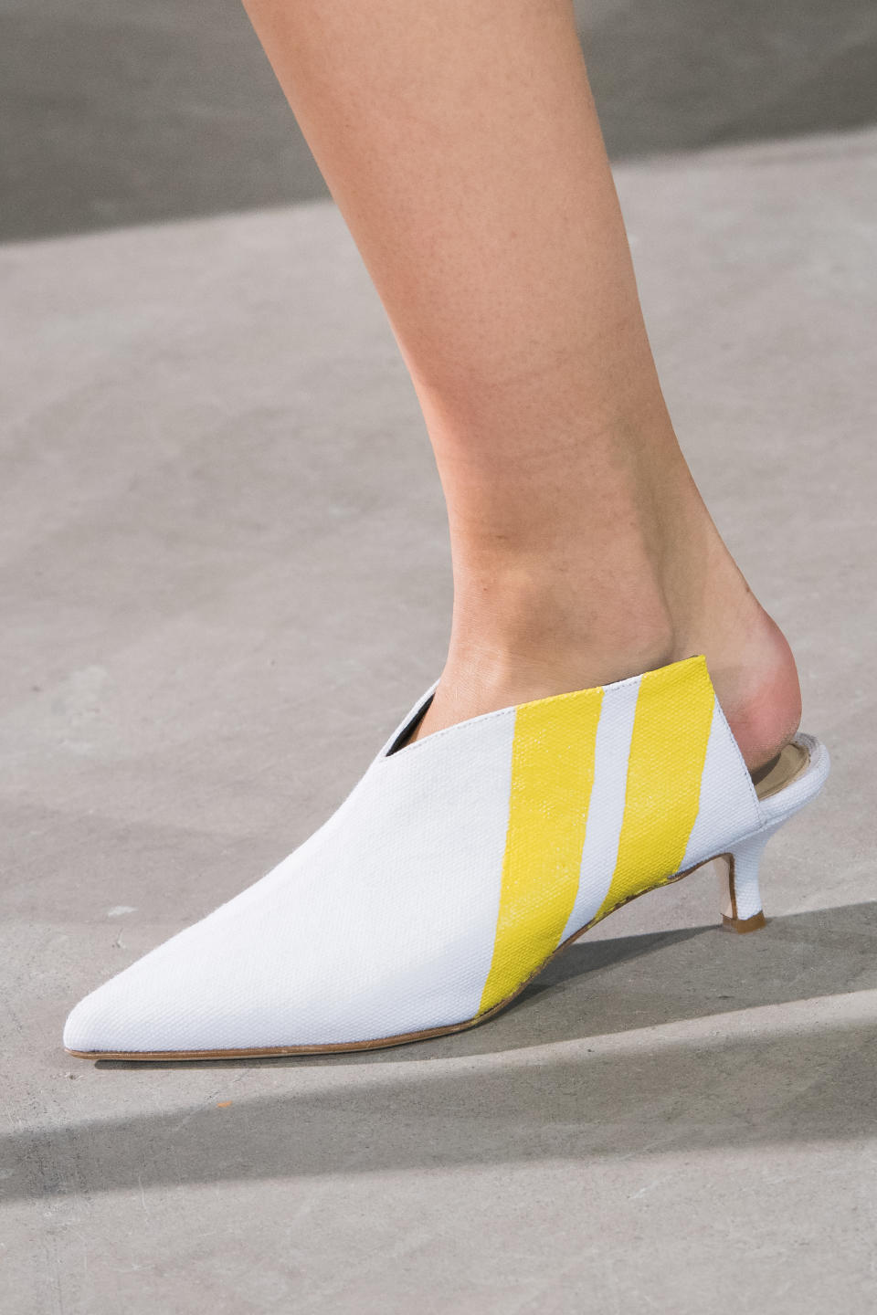 <p><i>Yellow-striped white mules from the SS18 Tibi collection. (Photo: ImaxTree) </i></p>