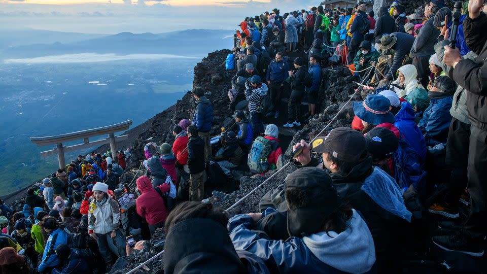 Crowds of tourists make their way to the summit of Mount Fuji to watch the sunrise. - Courtesy Yamanashi Prefectural Government