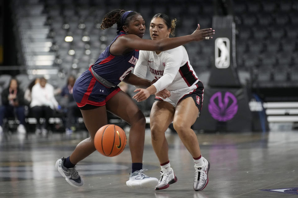 Stanford guard Talana Lepolo, right, passes around Belmont guard Tuti Jones (0) during the first half of an NCAA college basketball game Wednesday, Nov. 22, 2023, in Henderson, Nev. (AP Photo/John Locher)