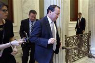 U.S. Senator Mike Lee (R-UT) (C) departs after a Republican Senate caucus meeting at the U.S. Capitol in Washington, October 16, 2013. REUTERS/Jonathan Ernst