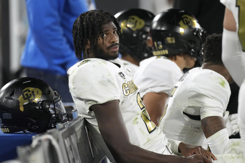 Colorado quarterback Shedeur Sanders sits on the bench in the closing seconds of the second half of an NCAA college football game against UCLA Saturday, Oct. 28, 2023, in Pasadena, Calif. (AP Photo/Mark J. Terrill)