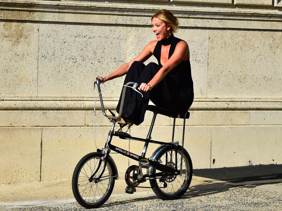 <p>Tall lady on a tiny bike.</p>