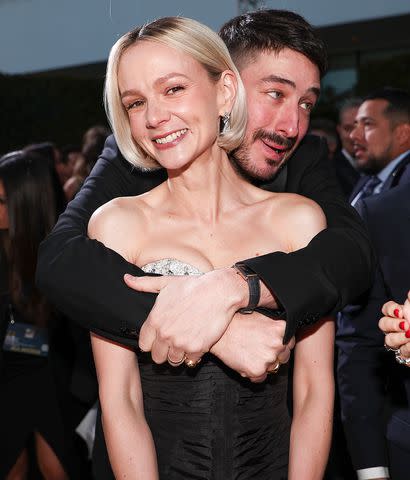 <p>Christopher Polk/Golden Globes 2024/Golden Globes 2024 via Getty </p> Carey Mulligan and Marcus Mumford